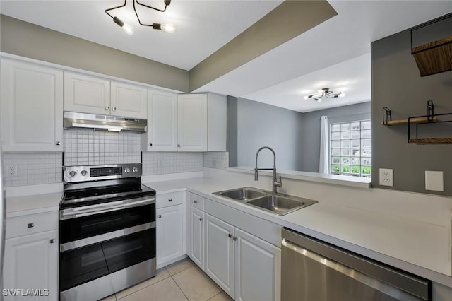 26672 Little John Ct Unit 85, Bonita Springs, FL 34135 - kitchen with appliances with stainless steel finishes, under cabinet range hood, a sink, and light countertops