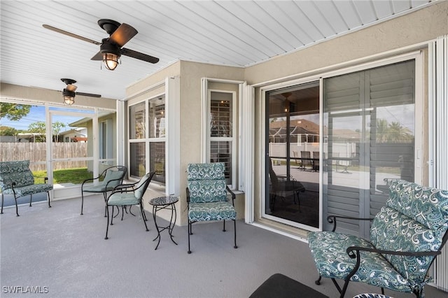 view of patio / terrace featuring fence and a ceiling fan
