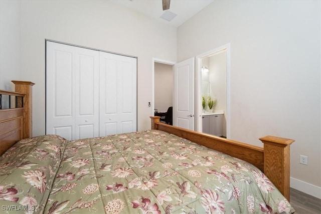 bedroom featuring a closet, wood finished floors, and a ceiling fan
