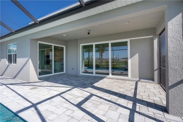 view of patio / terrace with a lanai