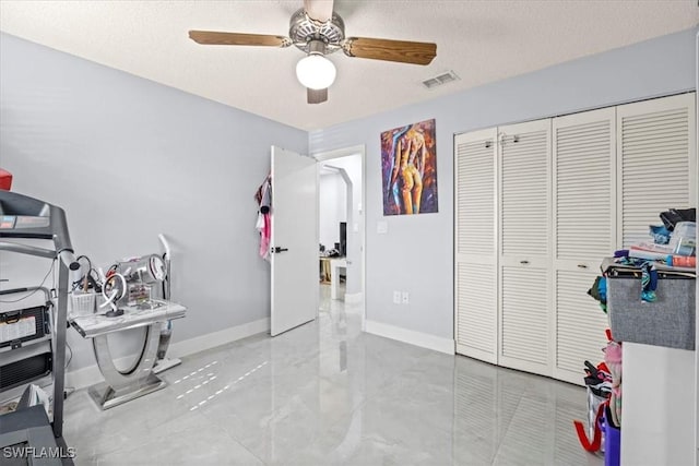 25068 Harborview Rd Unit 1B, Punta Gorda, FL 33980 - interior space featuring a textured ceiling, a closet, marble finish floor, baseboards, and visible vents