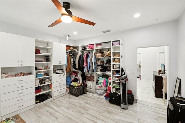 walk in closet featuring a ceiling fan and visible vents