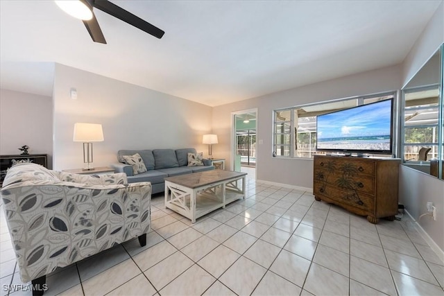 1147 Shady Rest Ln, Naples, FL 34103 - living area with light tile patterned floors and a ceiling fan