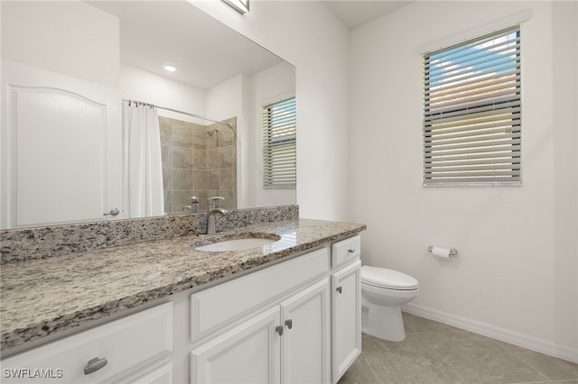 11555 Golden Oak Ter, Fort Myers, FL 33913 - bathroom with toilet, tile patterned floors, a healthy amount of sunlight, and baseboards