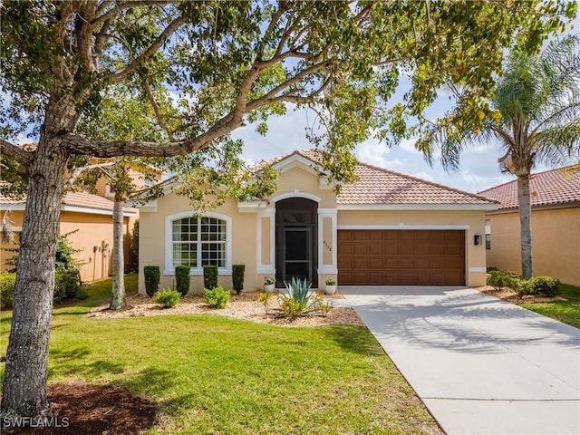 view of front of house featuring a front lawn, a garage, driveway, a tiled roof, and stucco siding