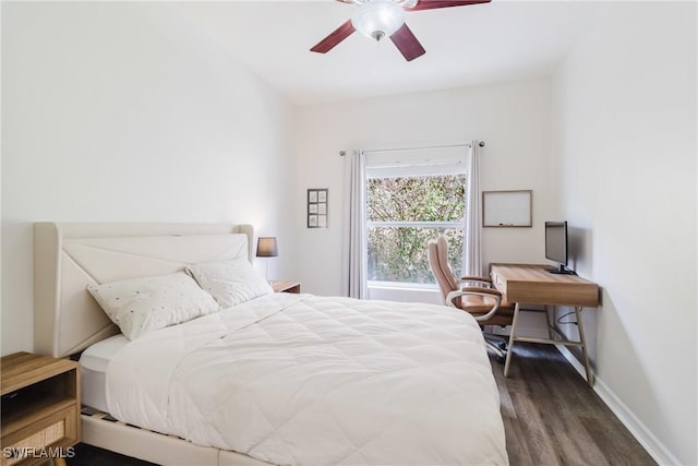 bedroom with baseboards, wood finished floors, and ceiling fan