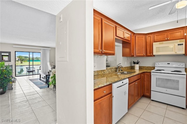 17150 Ravens Roost Unit 3, Fort Myers, FL 33908 - kitchen with a sink, a textured ceiling, light tile patterned flooring, a ceiling fan, and white appliances