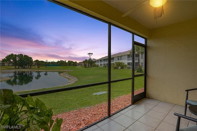 17150 Ravens Roost Unit 3, Fort Myers, FL 33908 - sunroom featuring a ceiling fan and a water view