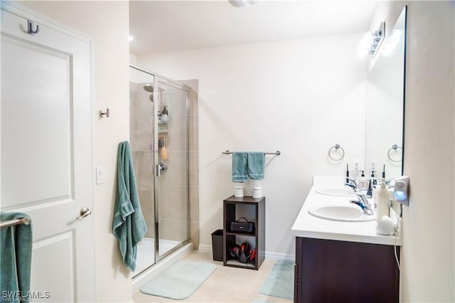 8880 Cascade Price Cir, North Fort Myers, FL 33917 - bathroom featuring double vanity, a shower stall, and tile patterned flooring
