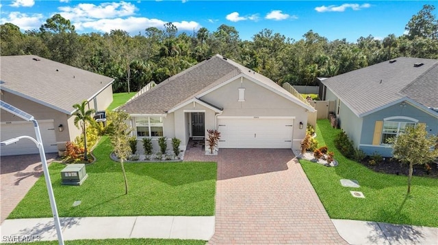 8880 Cascade Price Cir, North Fort Myers, FL 33917 - ranch-style house with a garage, decorative driveway, and stucco siding