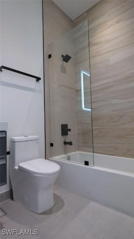 308 SW 13th Ct, Cape Coral, FL 33991 - bathroom with toilet, bathtub / shower combination, and tile patterned flooring