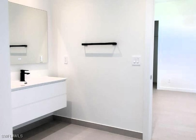 308 SW 13th Ct, Cape Coral, FL 33991 - bathroom featuring vanity and baseboards