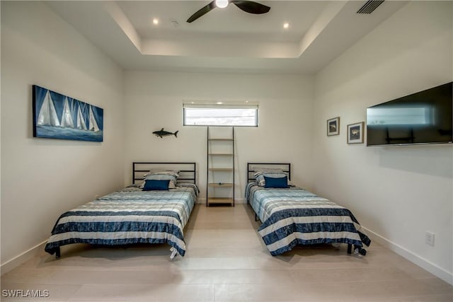 308 SW 13th Ct, Cape Coral, FL 33991 - bedroom with a tray ceiling and ceiling fan