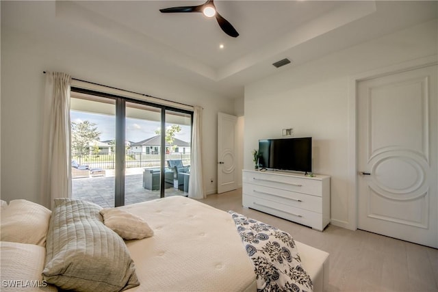 308 SW 13th Ct, Cape Coral, FL 33991 - bedroom with access to exterior, a raised ceiling, and ceiling fan
