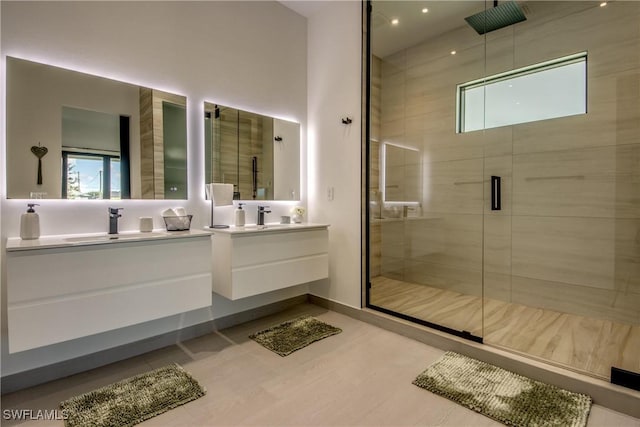 308 SW 13th Ct, Cape Coral, FL 33991 - bathroom with double vanity, a shower stall, and wood finished floors