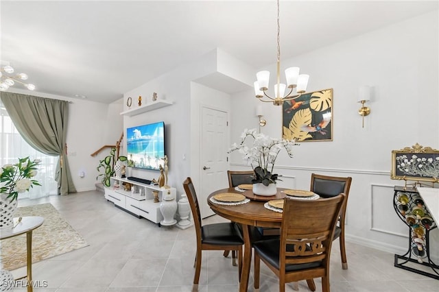 2926 Citrus St, Naples, FL 34120 - dining space with a chandelier and light tile patterned floors