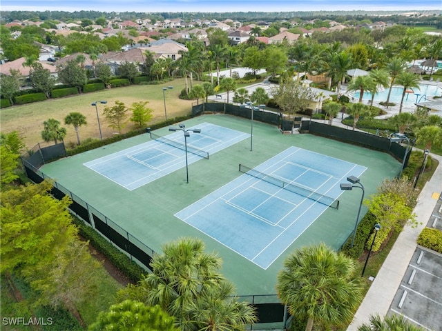 2926 Citrus St, Naples, FL 34120 - view of tennis court featuring fence