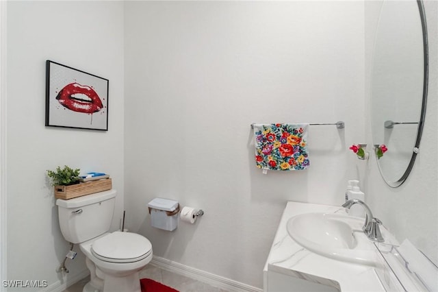 2926 Citrus St, Naples, FL 34120 - bathroom with baseboards, toilet, vanity, and tile patterned floors