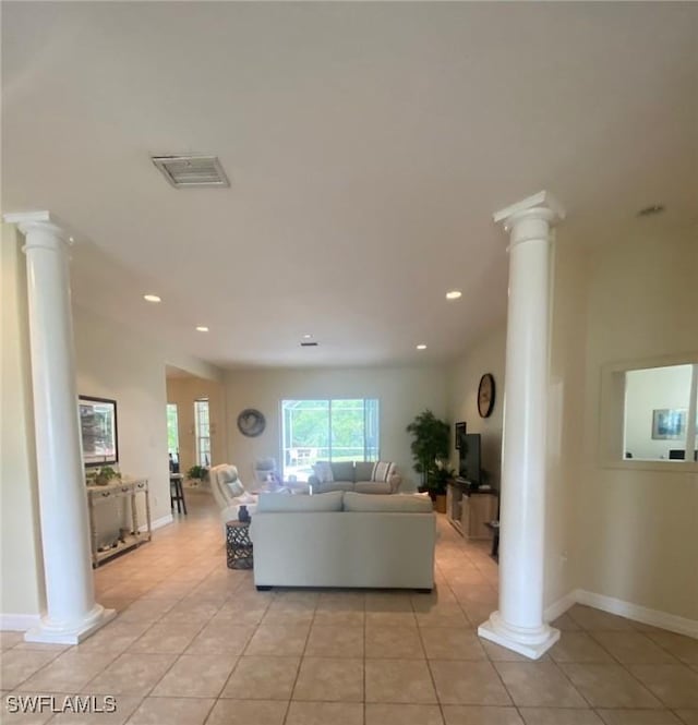 9623 Springlake Cir, Estero, FL 33928 - living room featuring ornate columns, light tile patterned flooring, baseboards, and recessed lighting