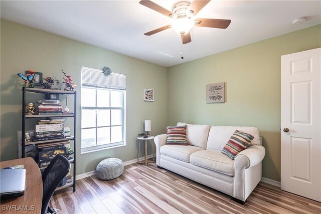 513 SE 27th Ter, Cape Coral, FL 33904 - living room featuring baseboards, a ceiling fan, and wood finished floors