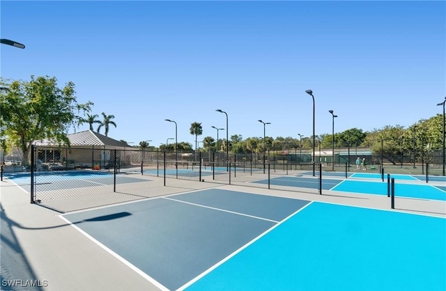 exterior space with fence and community basketball court
