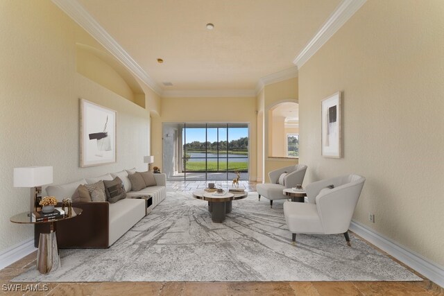 10326 Wishing Stone Ct, Bonita Springs, FL 34135 - living room featuring arched walkways, baseboards, and ornamental molding