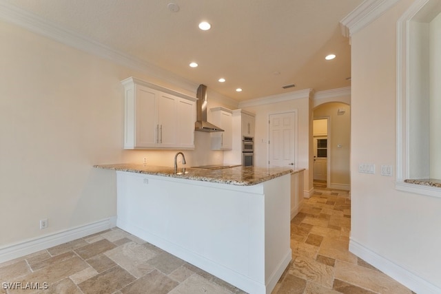 10326 Wishing Stone Ct, Bonita Springs, FL 34135 - kitchen with crown molding, light stone countertops, arched walkways, and stone finish flooring