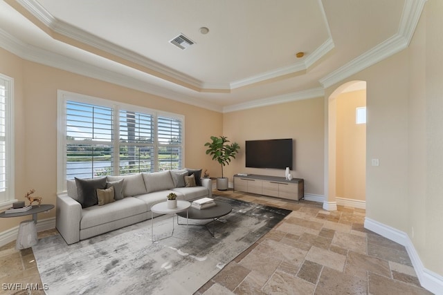 10326 Wishing Stone Ct, Bonita Springs, FL 34135 - living area featuring ornamental molding, visible vents, arched walkways, and a tray ceiling