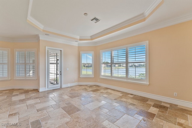 10326 Wishing Stone Ct, Bonita Springs, FL 34135 - empty room featuring a tray ceiling, ornamental molding, visible vents, baseboards, and stone tile flooring