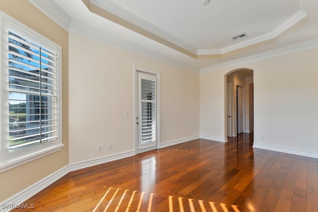 10326 Wishing Stone Ct, Bonita Springs, FL 34135 - unfurnished room featuring ornamental molding, visible vents, arched walkways, and hardwood / wood-style flooring