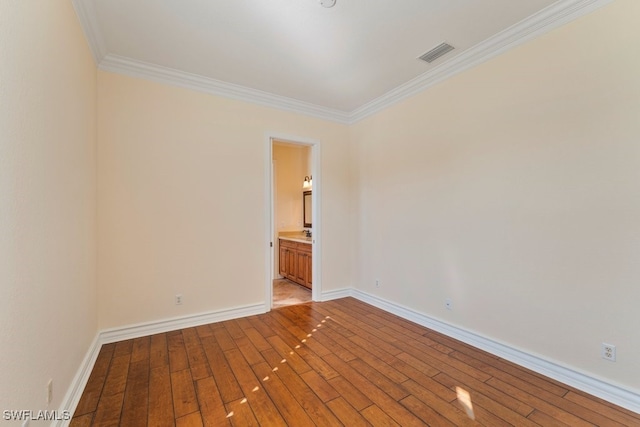 10326 Wishing Stone Ct, Bonita Springs, FL 34135 - unfurnished room with crown molding, light wood finished floors, baseboards, and visible vents
