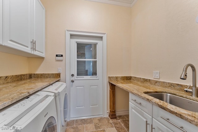 10326 Wishing Stone Ct, Bonita Springs, FL 34135 - laundry area featuring crown molding, stone finish floor, washing machine and clothes dryer, a sink, and cabinet space