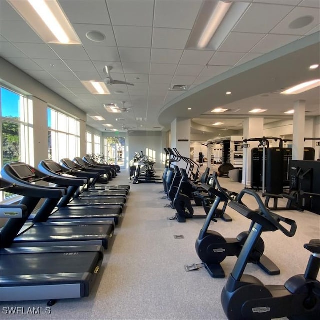 workout area featuring visible vents and a paneled ceiling