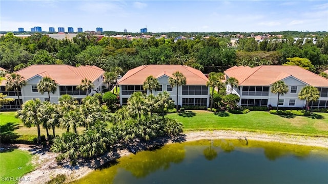 birds eye view of property featuring a water view