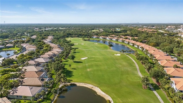 aerial view featuring a residential view, a water view, and view of golf course