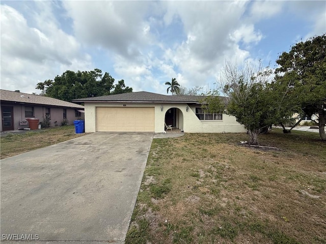 338 Melody Ct, Fort Myers, FL 33916 - single story home with stucco siding, driveway, an attached garage, and a front lawn