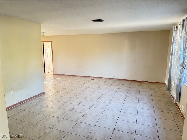 338 Melody Ct, Fort Myers, FL 33916 - spare room featuring light tile patterned flooring, baseboards, and healthy amount of natural light