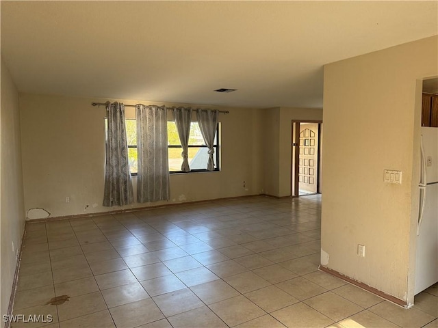 338 Melody Ct, Fort Myers, FL 33916 - empty room with light tile patterned flooring and baseboards