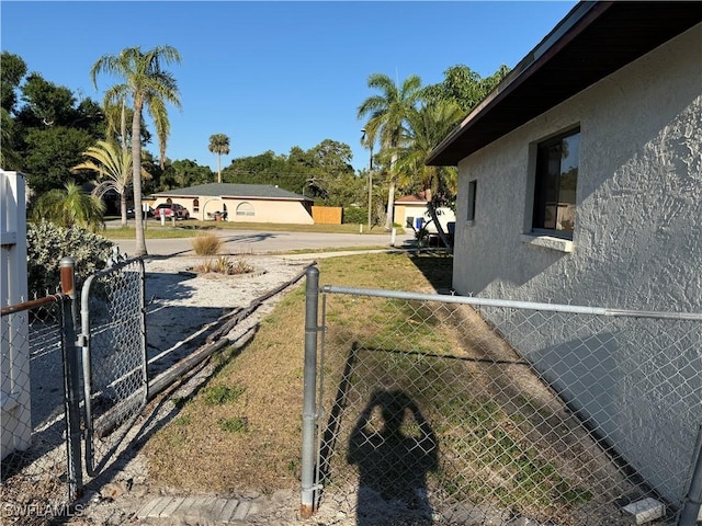 338 Melody Ct, Fort Myers, FL 33916 - view of yard featuring a gate