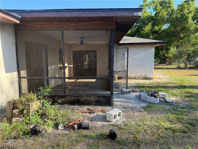 338 Melody Ct, Fort Myers, FL 33916 - entrance to property with ceiling fan, stucco siding, and a yard