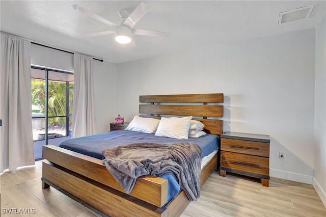 2226 SE 19th Pl, Cape Coral, FL 33990 - bedroom with access to exterior, light wood finished floors, baseboards, and a ceiling fan