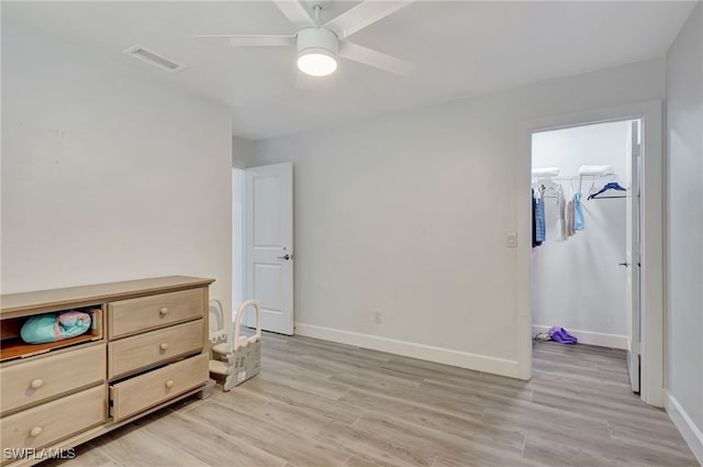 2226 SE 19th Pl, Cape Coral, FL 33990 - bedroom with a spacious closet, visible vents, baseboards, and light wood-style flooring