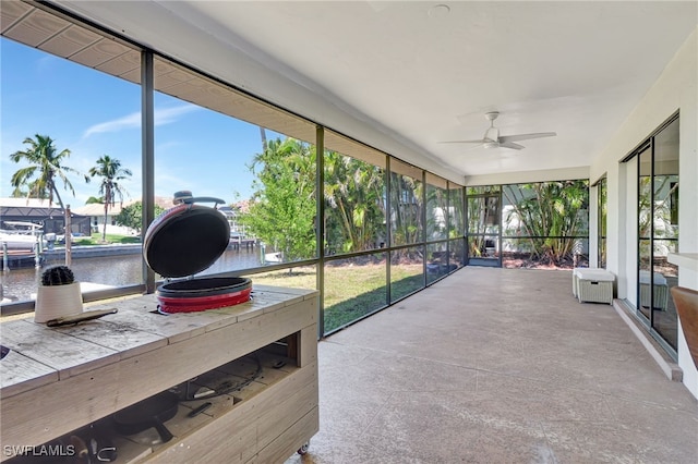 2226 SE 19th Pl, Cape Coral, FL 33990 - sunroom / solarium featuring a ceiling fan and a water view