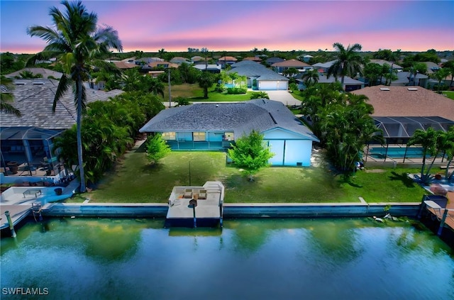 2226 SE 19th Pl, Cape Coral, FL 33990 - aerial view at dusk featuring a water view and a residential view