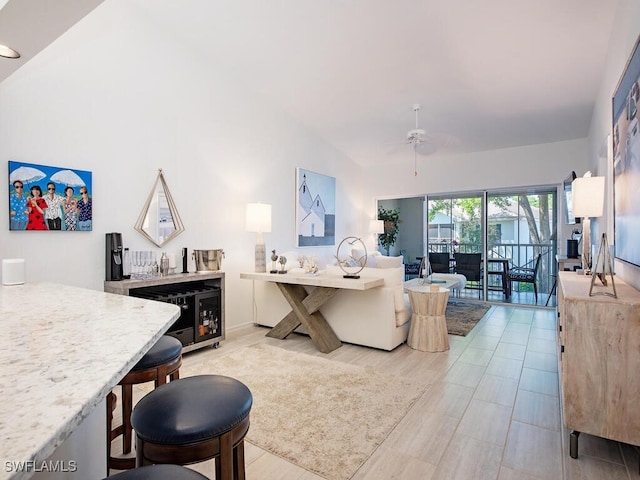 living area featuring a ceiling fan