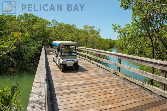 wooden deck featuring a water view