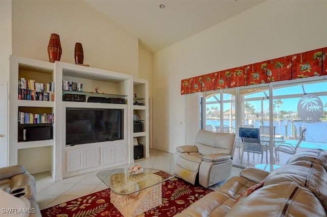 330 SW 33rd Ave, Cape Coral, FL 33991 - living room with high vaulted ceiling, built in shelves, and light tile patterned flooring