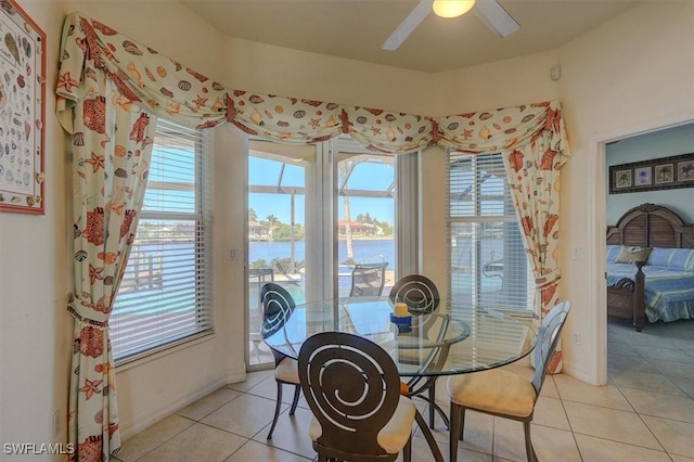 330 SW 33rd Ave, Cape Coral, FL 33991 - dining space featuring light tile patterned floors, a water view, and plenty of natural light