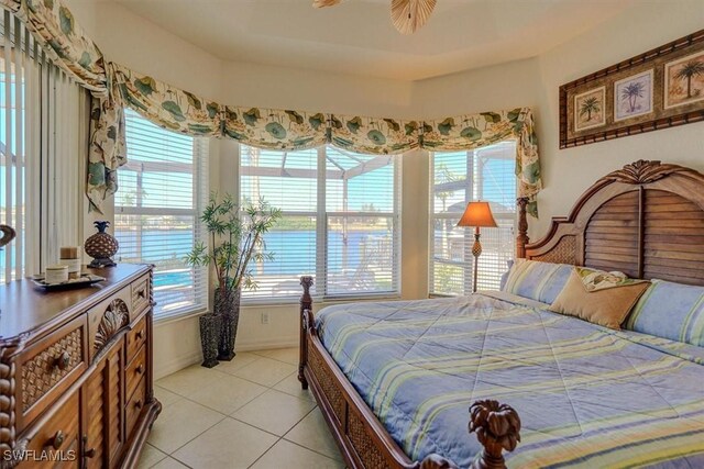 330 SW 33rd Ave, Cape Coral, FL 33991 - bedroom featuring baseboards, light tile patterned flooring, and multiple windows