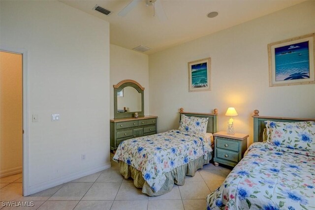 330 SW 33rd Ave, Cape Coral, FL 33991 - bedroom with baseboards, visible vents, light tile patterned floors, and ceiling fan